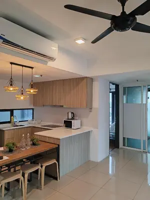 a kitchen with a ceiling fan and a table at \u69df\u57ce\u4e2d\u8def\u4e09\u623f \u7231\u5c45\u5c4b in George Town