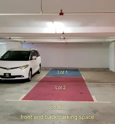 a white car parked in a parking garage at \u69df\u57ce\u4e2d\u8def\u4e09\u623f \u7231\u5c45\u5c4b in George Town
