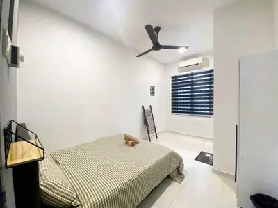 a bedroom with a bed and a ceiling fan at 2 Storey Stylish Comfort Retreat ````AlmaImpianRia in Bukit Mertajam