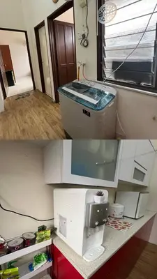 a kitchen with a coffee maker on a counter at Azriff homestay in Seri Iskandar