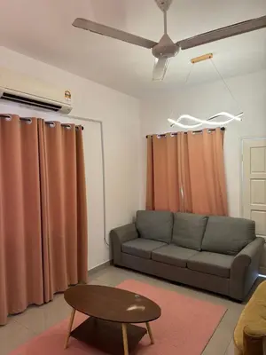 a living room with a couch and a table at FHS Homestay Trong Taiping in Bukit Gantang