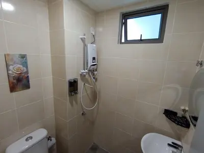 a bathroom with a shower and a toilet at Palas Horizon Home B-7-11 in Brinchang