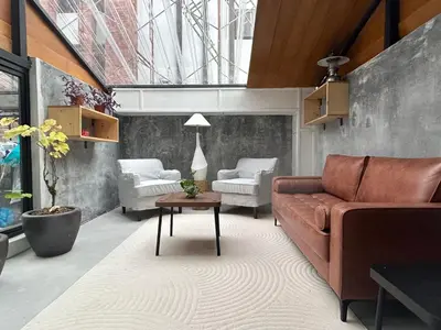 a living room with a couch and a table at Silvan Garden Cameron Highlands in Tanah Rata