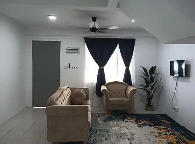 a living room with two chairs and a window at Kak Chik Homestay Tasek Gelugor in Kampong Ayer Melintas Besar