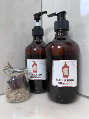 two bottles of hair and body shampoo and a jar of seeds at Stylish&Affordable Serenity Suite #2min KekLokSi in Ayer Itam
