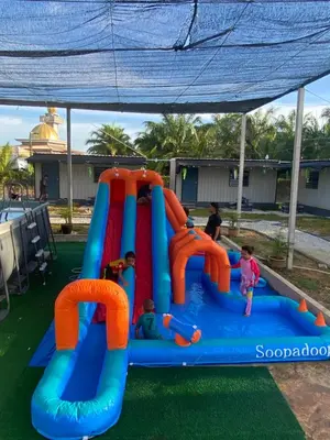 a group of children playing in an inflatable playground at YN cabin in Tanjung Karang