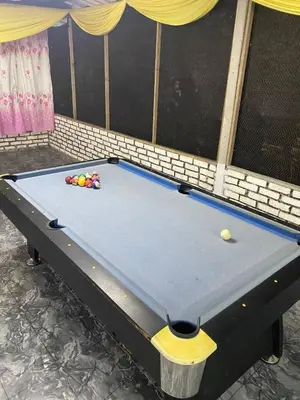 a pool table with balls on top of it at YN cabin in Tanjung Karang
