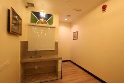 a bathroom with a sink and a stained glass window at Shamrock Guest House II in Ipoh