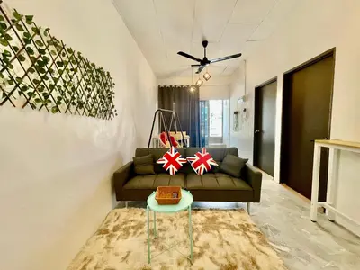 a living room with a couch and a table at Home41#6pax#netflix#NearIconCity&AeonAlma in Bukit Mertajam