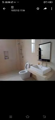 a bathroom with a toilet and a sink at Lumut Marina in Lumut
