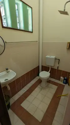 a bathroom with a toilet and a sink at Musa Seri Iskandar Homestay in Seri Iskandar