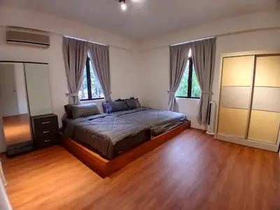 a bedroom with a bed and two windows at Noble Villa Condo Georgetown City Center Macalister 3 Bedroom 3 Carpark in George Town