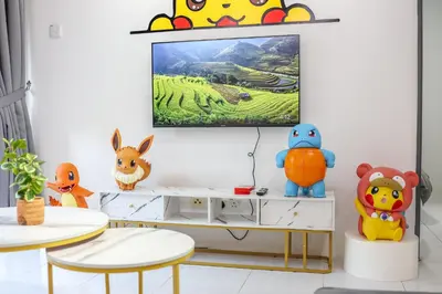 a living room with a tv on a wall at Luxury Pokémon Haven with Private Playground Brinchang Cameron Highlands Clover Home 2-28 in Brinchang
