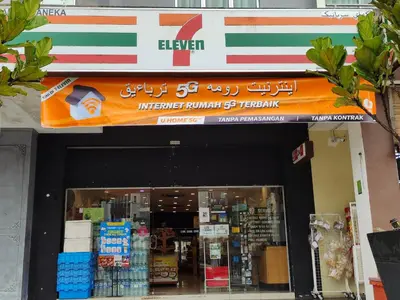 a store front of a store with an orange sign at Cameron Golden Hills Near Night Market CH1 in Brinchang