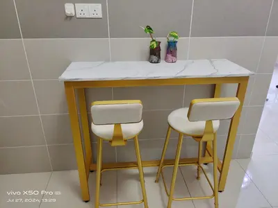 a counter with two stools in a bathroom at Residensi Meru Raya in Ipoh
