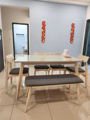 a dining room table with four chairs and a mirror at CATAILIS Metropol Serviced Apartment Bandar Perda Bukit Mertajam near Penang Bridge in Bukit Mertajam