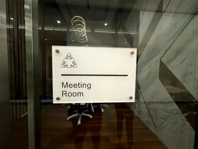 a sign in a glass door of a meeting room at cozy 3BR family suites 10pax in Jelutong