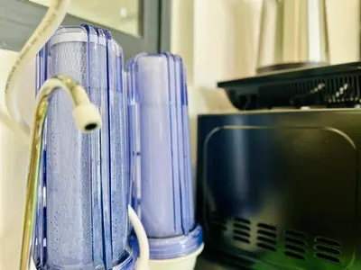 a couple of blue containers sitting next to a computer at cozy 3BR family suites 10pax in Jelutong