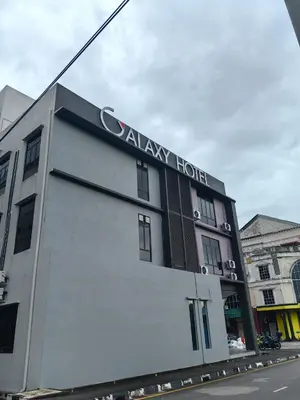 a building with a sign on the side of it at Galaxy Hotel Bandar Perda in Bukit Mertajam