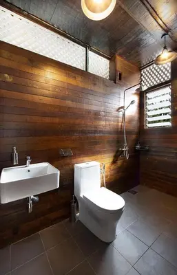 a bathroom with a toilet and a sink at Bagas Zakariah Orchard Lodge in Gopeng