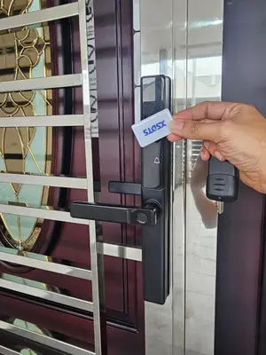 a person holding a key to a door at V-Home Taiping, 3BR, 7pax, Full Aircond, Wifi & Netflix, Early Bird Promo in Taiping
