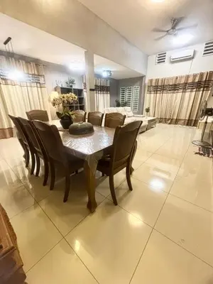 a dining room with a table and chairs at Hannah Homestay Ipoh in Ipoh