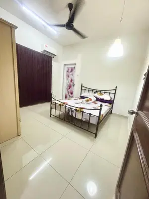 a bedroom with a bed and a ceiling at Hannah Homestay Ipoh in Ipoh