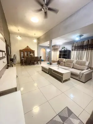 a large living room with a couch and a table at Hannah Homestay Ipoh in Ipoh