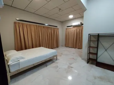 a bedroom with a bed and a tiled floor at Homestay 39 Private Pool Perak in Tanjung Rambutan