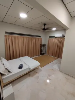 a bedroom with a bed in a room with curtains at Homestay 39 Private Pool Perak in Tanjung Rambutan