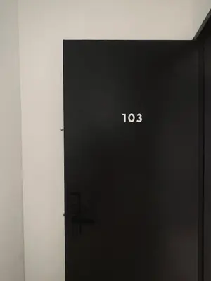 a black door with the number on it at 39 Haus in Bukit Mertajam