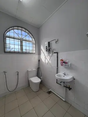 a bathroom with a toilet and a sink at Teratak Segar Bayu - Musslim Only Tanjong Malim Perak in TanjongMalim