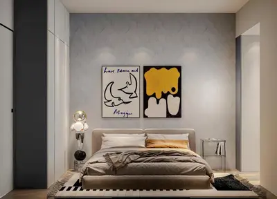 a bedroom with a bed and some pictures on the wall at knn in Gelugor