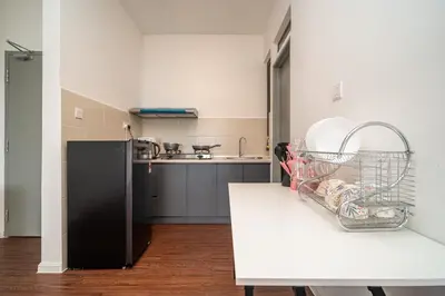 a kitchen with a dish rack on a table at Serene Japandi Family Retreat 2-7pax &Sunrise View in Brinchang