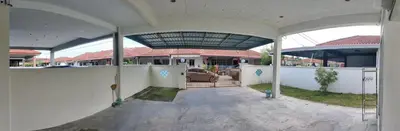 an outside view of a house with a patio at 13paxs Semi D Homestay Hutan Melintang in Hutan Melintang