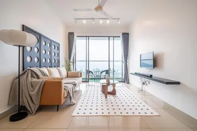 a living room with a couch and a table at Serene Minimalist Family Retreat 2-7pax &Sunrise View in Brinchang