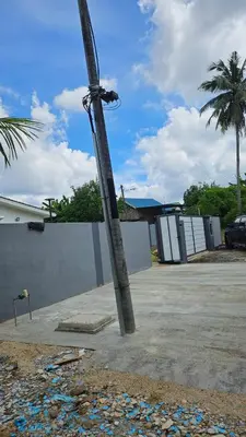 a street light on a pole in a parking lot at Sastred villa Mus'lim Only in Sungai Petani