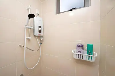 a shower in a bathroom with a shower head at Serene Industrial Family Retreat 2-7pax &Sunrise view in Brinchang