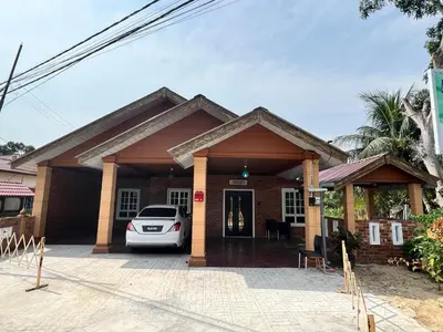 a house with a car parked in front of it at Bola-Bola DHomestay in Kepala Batas