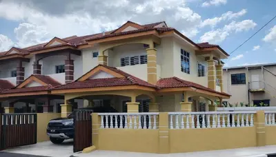 a yellow and white house with a fence at Homestay Tasnim Bertam 5 Rooms Corner lot in Kepala Batas