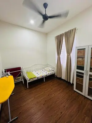 a bedroom with a bed and a ceiling fan at Inap Kasih Homestay Gua Musang Bandar Utama - Free Wifi, Netflix, Coway Provided in Gua Musang