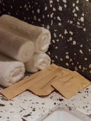 a pile of towels next to a pile of towels at Break & Stay formerly known as BreakX Hotel in George Town