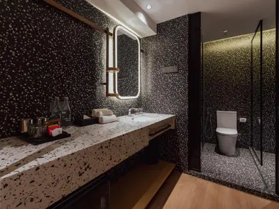 a bathroom with a sink and a toilet at Break & Stay formerly known as BreakX Hotel in George Town