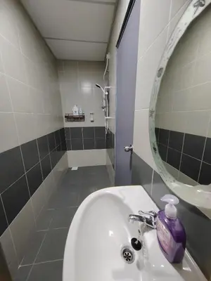 a bathroom with a sink and a mirror at MujiStyle Brinchang Emerald Apartment Cameron 8guests 3bedrooms3bathroom in Brinchang