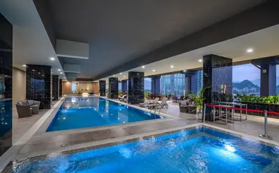 a swimming pool in a hotel with a view at ICC Ipoh Town Premium Suites By IWH Suites in Ipoh