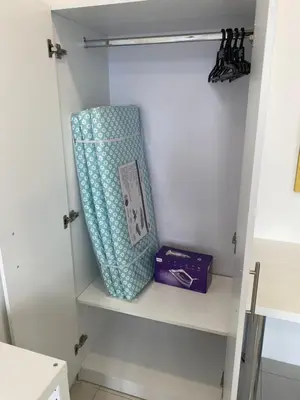 a suitcase sitting on a shelf in a closet at EG Home at The Anderson in Ipoh