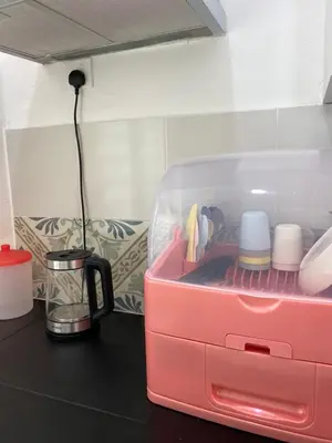 a pink lunch box sitting on top of a counter at EG Home at The Anderson in Ipoh