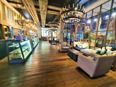 a large room with couches and chairs in a store at M Boutique Hotel Station 18 - Ipoh in Ipoh