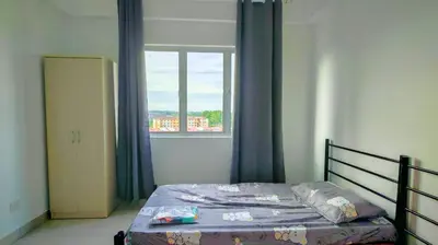 a bedroom with a bed and a window at Kampar Lake House - Bandar Baru Kampar City Centre in Kampar