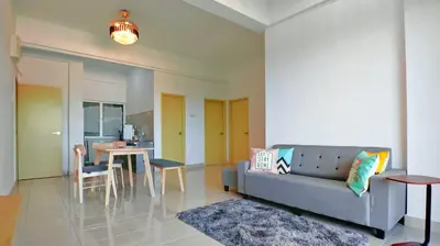 a living room with a couch and a table at Kampar Lake House - Bandar Baru Kampar City Centre in Kampar